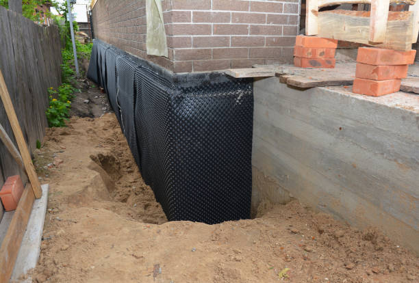 SJ Waterproofing Pros technician performing targeted Waterproofing assessment in Orchard Park, NY